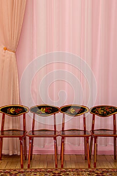 Curtain background with highchairs