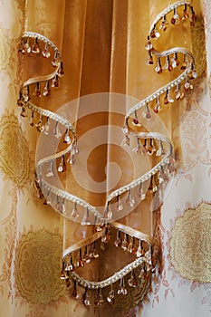 Curtain with an ornament