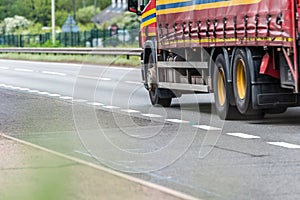 Curtain side truck on uk motorway in fast motion