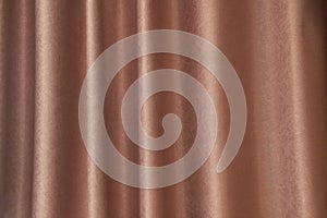 Curtain wave with a pattern background, macro texture of brown striped fabric