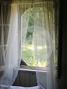 Curtains in the breeze photo