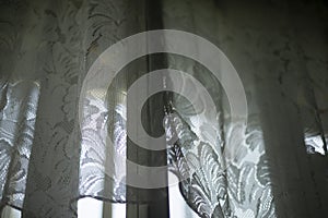 Curtains on window. White curtains in room. Old window