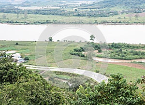 Curve asphalt road along the large river.