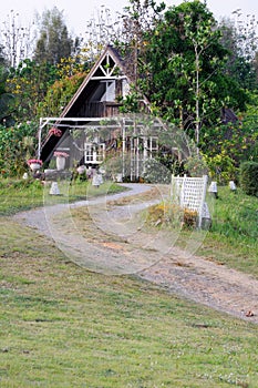 Curve dirt road to the countryside house