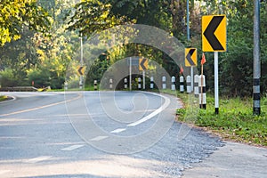 Curve in the forest, Bend street up to the mountain, Traffic warning sign label for show that the road curves