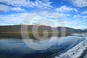 Curve line of water foam at the stern of cruise ship cruising the Beagle channel, Patagonia, Argentina