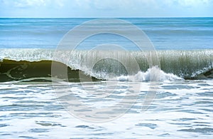 Curve of ocean wave with splash of water, Thailand