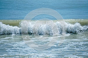 Curve of ocean wave with splash of water, Thailand