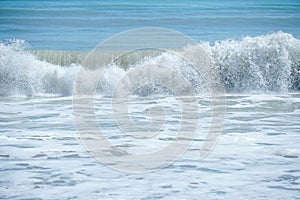 Curve of ocean wave with splash of water, Thailand