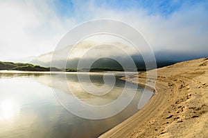 Curve river with mountain cloudy fog