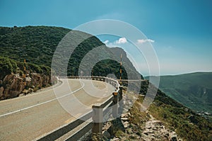 Curve roadway passing through rocky landscape