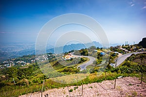 Curve and winding rural road along the mountain at Phu Thap Boek
