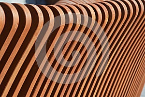 Curved brown wooden slats. Bench element. Abstract background