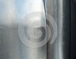 Curved brushed steel abstract surface with joins and curves