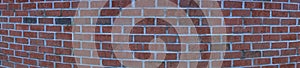 Panorama of rounded brick wall