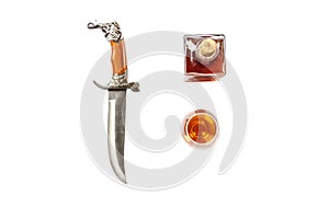 Curved ceremonial dagger knife decanter glass of whiskey isolated on white background. Vintage dagger on white background. Dagger