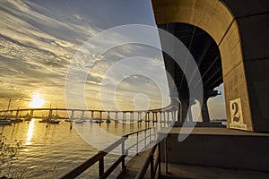 Curved Coronado Bridge at sunrise over San Diego Bay