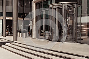 Curved doorway to the office, bank, corporation. Glass and metal doors.