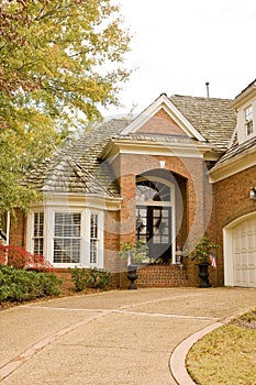 Curved Driveway to Brick Entrance