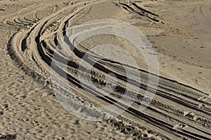 Curved four wheel drive tracks in soft sand