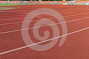curved lane in running track or athlete track in stadium. Running track is a rubberized artificial running surface for track and f