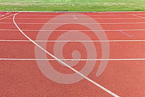 curved lane in running track or athlete track in stadium. Running track is a rubberized artificial running surface for track and f