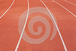 Curved lane in running track or athlete track in stadium. Running track is a rubberized artificial running surface for track and f