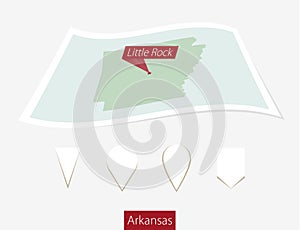 Curved paper map of Arkansas state with capital Little Rock on G