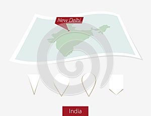 Curved paper map of India with capital New Delhi on Gray Background. Four different Map pin set.