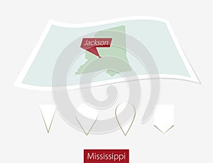 Curved paper map of Mississippi state with capital Mississippi o