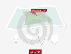 Curved paper map of Missouri state with capital Jefferson City o