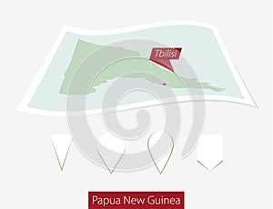 Curved paper map of Papua New Guinea with capital Port Moresby o