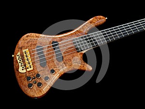 Curved patterned wood bass guitar on black