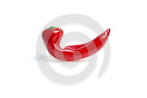 Curved red pepper on a white background photo