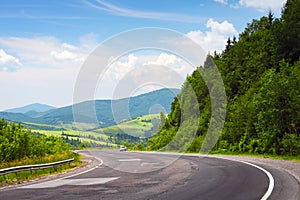 Curved road and car in mountains