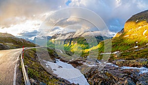 Curved road and mountain valley panorama on the way from Dalsnibba to Geiranger fjord, Geiranger, Sunnmore,  Romsdal county, photo