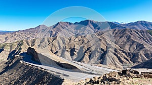 Curved road in Tizi n Tichka mountain pass in the Atlas Mountains. Road to the Sahara desert. Travel concept. High Atlas, Morocco