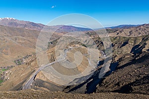 Curved road in Tizi n Tichka mountain pass in the Atlas Mountains. Road to the Sahara desert. Travel concept. High Atlas, Morocco