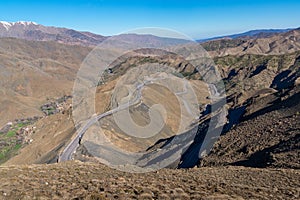 Curved road in Tizi n Tichka mountain pass in the Atlas Mountains. Road to the Sahara desert. Travel concept. High Atlas, Morocco