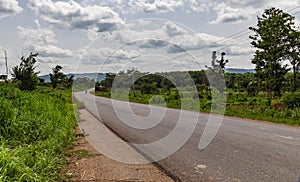 Curved rural road Ekiti State Nigeria photo