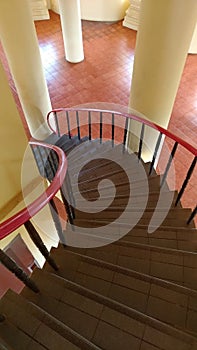 The curved staircase inside the building.