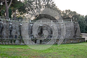 Curved Stone Terrace with Statues and Fountain at the Historic Villa Lante, Italy photo