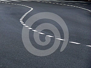 Curved Traffic Marks on Asphalt