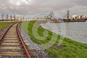 Curved train tracks along a harbor in Dordrecht