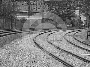 curved train tracks black and white