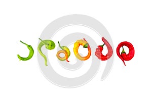 curved and twisted unusual green yellow and red hot chili pepper isolated on a white background