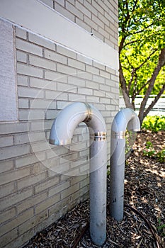 Curved ventilation pipe used to equalize pressure and provide air to an underground pumping wastewater sewage station.