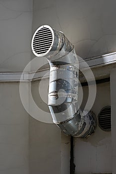 Curved ventilation pipe on the wall