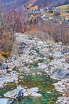 The curved Verzasca River amid the rocks, Frasco, Valle Verzasca, Switzerland photo