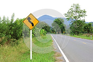 Curved way ahead traffic road warning sign.